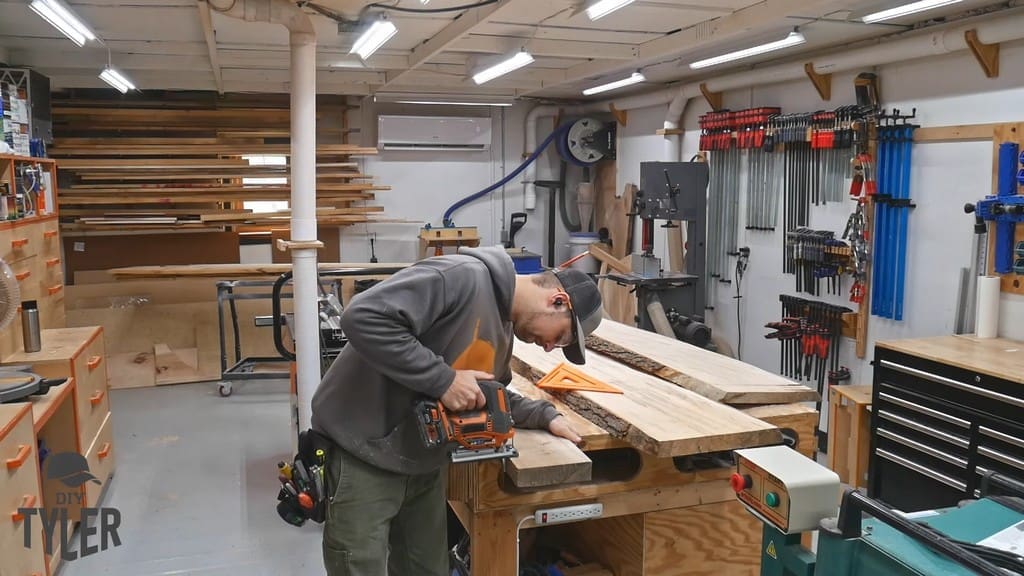 man cutting off piece of maple wood slab