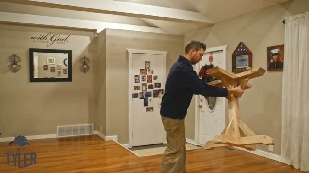 man arranging game table pedestal piece